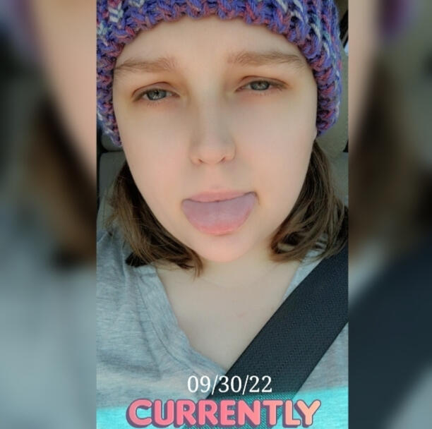 A selfie of myself, tongue stuck out & wearing a beanie with my short hair (right above my shoulders). Dated 9/30/22